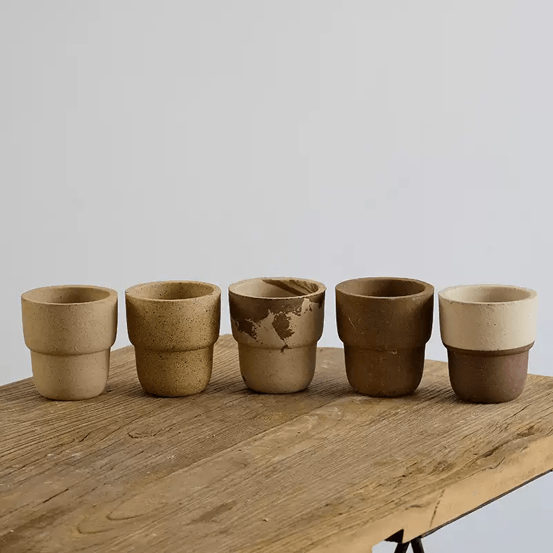 4-inch carry cup clay pots in earthy tones—beige, sand, marbled, and brown. Perfect for succulents and adding rustic charm to decor.