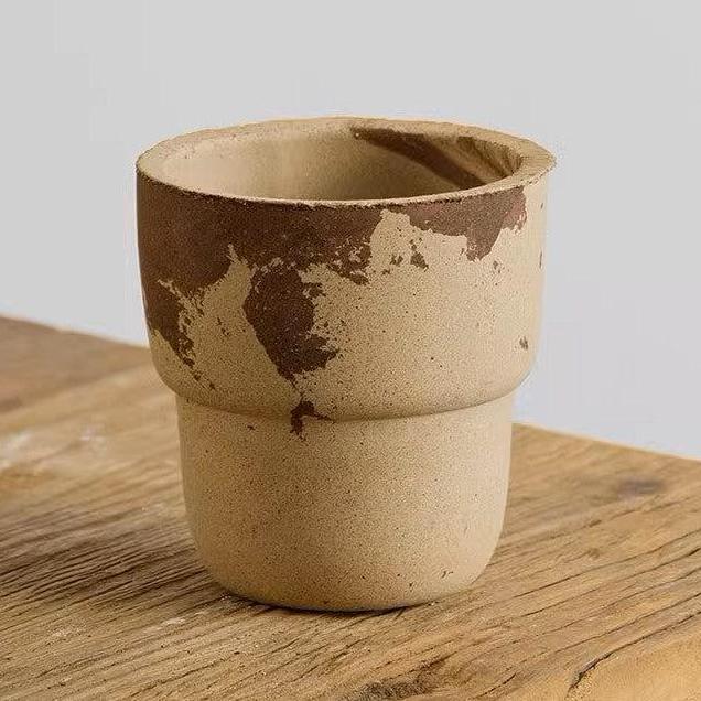 4-inch marbled carry cup terracotta pot with unique earthy patterns. Perfect for small plants, adding a rustic, natural charm to indoor decor.