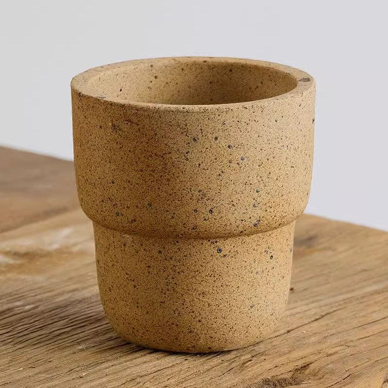 4-inch speckled carry cup stoneware pot with a natural, earthy finish. Great for small plants, adding a textured, rustic element to indoor decor.