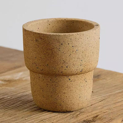 4-inch speckled carry cup stoneware pot with a natural, earthy finish. Great for small plants, adding a textured, rustic element to indoor decor.