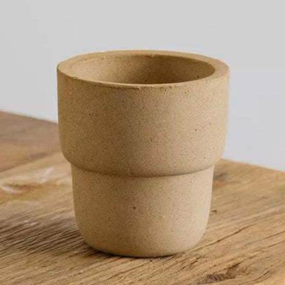 4-inch white carry cup ceramic pot with a minimalist design. Ideal for small plants, adding an earthy, natural touch to any decor.