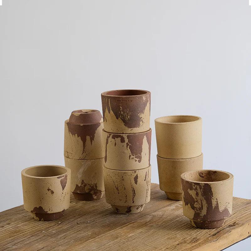 5-inch brown cylindrical clay pot with marble finish, ideal for small plants. Natural earthy design with a rustic touch.