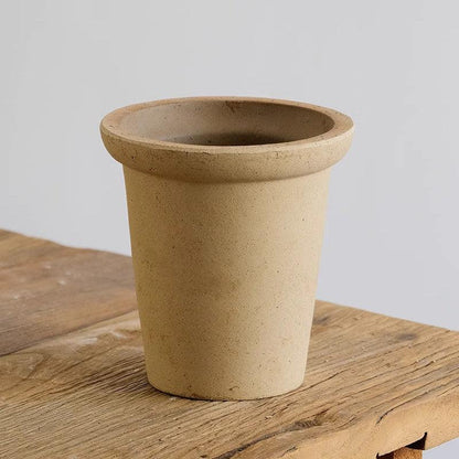 6-inch white terracotta planter with a classic tapered design. Neutral clay pot perfect for small indoor plants, featuring a subtle earthy tone.