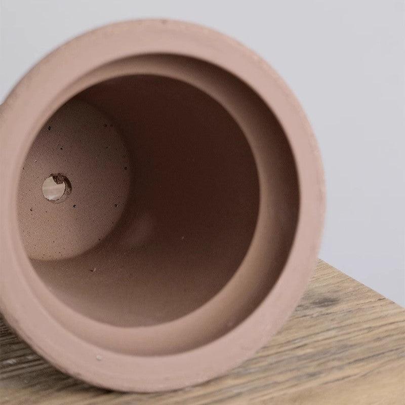 Inside view of an 7-inch brown tall pot featuring a drainage hole. Perfect for promoting healthy root growth in small trees and deep-rooted plants.