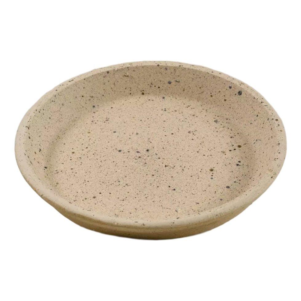 Beige clay saucer for plants, versatile as a tray or dish, with speckled texture. Ideal for catching water drainage and protecting surfaces indoors.