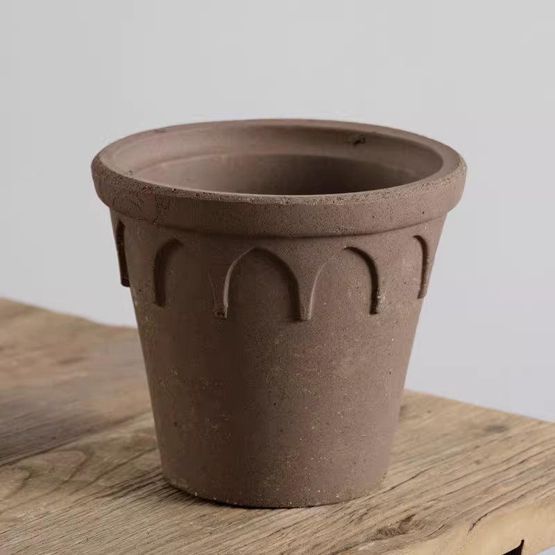 10-inch brown rustic clay crown planter with elegant arches, perfect for large indoor plants; crafted from durable earthenware with drainage.