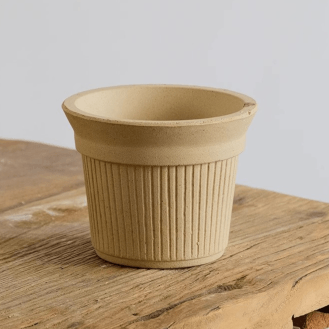 5-inch white Brûlée cup clay pot with ribbed texture, perfect for indoor plants or succulents. Ideal for adding a minimalist, natural touch to decor.