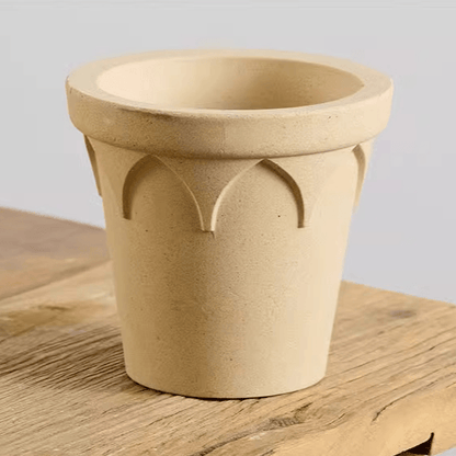 4-inch white clay crown planter, perfect for small plants; features a classic, rustic look with drainage hole.