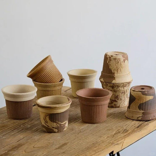 5-inch small Brûlée cup-shaped terracotta flower pots in earthy beige and cocoa tones with ribbed textures, ideal for plants and succulents in indoor or outdoor decor.