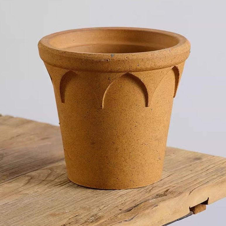 6-inch rustic brown clay crown planter with decorative arches, perfect for medium plants; features earthy golden tones and a drainage hole for healthy roots.